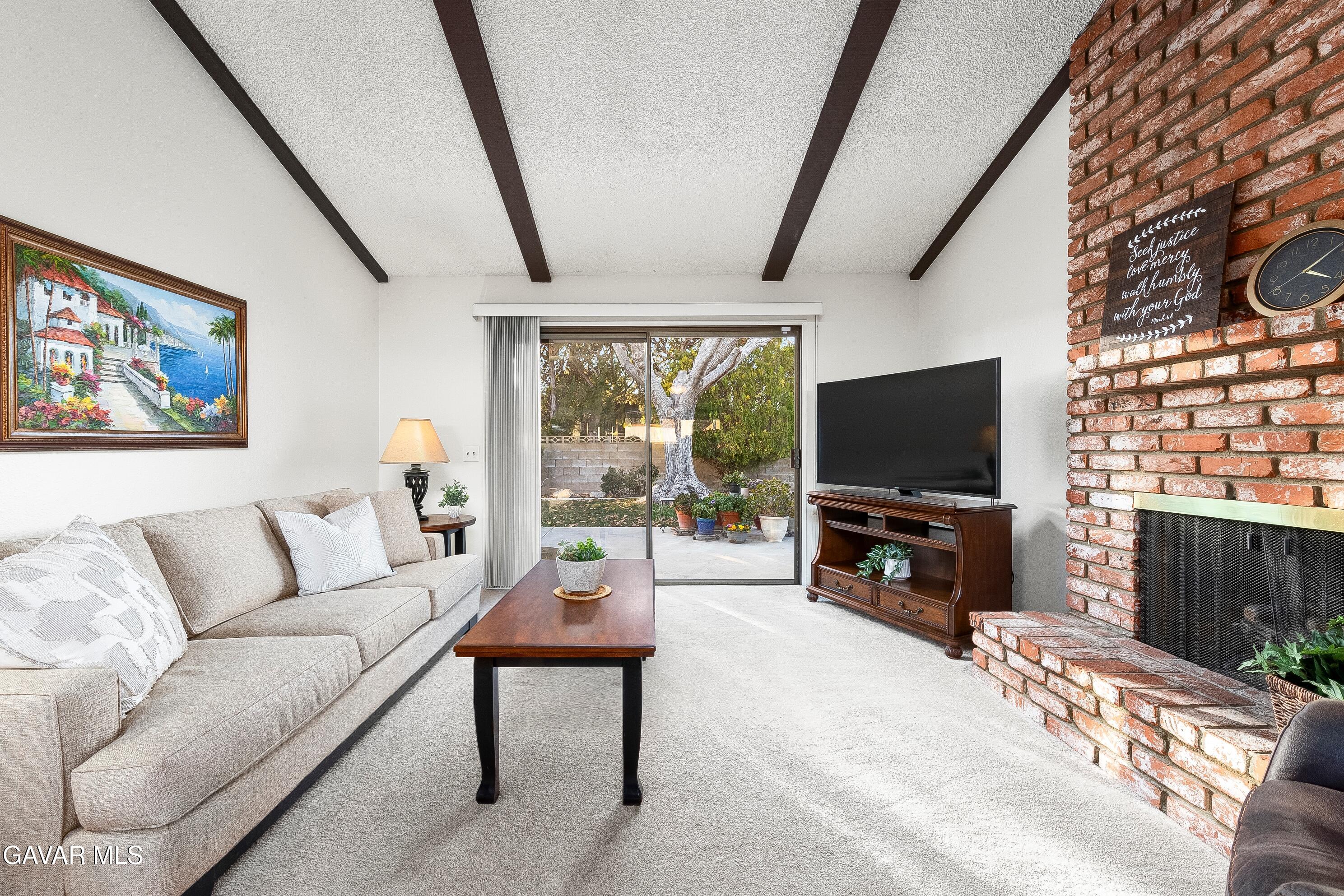 43755 Sentry Lane Lancaster, CA 93536 - Photo 9 of 36 a living room with furniture and a flat screen tv