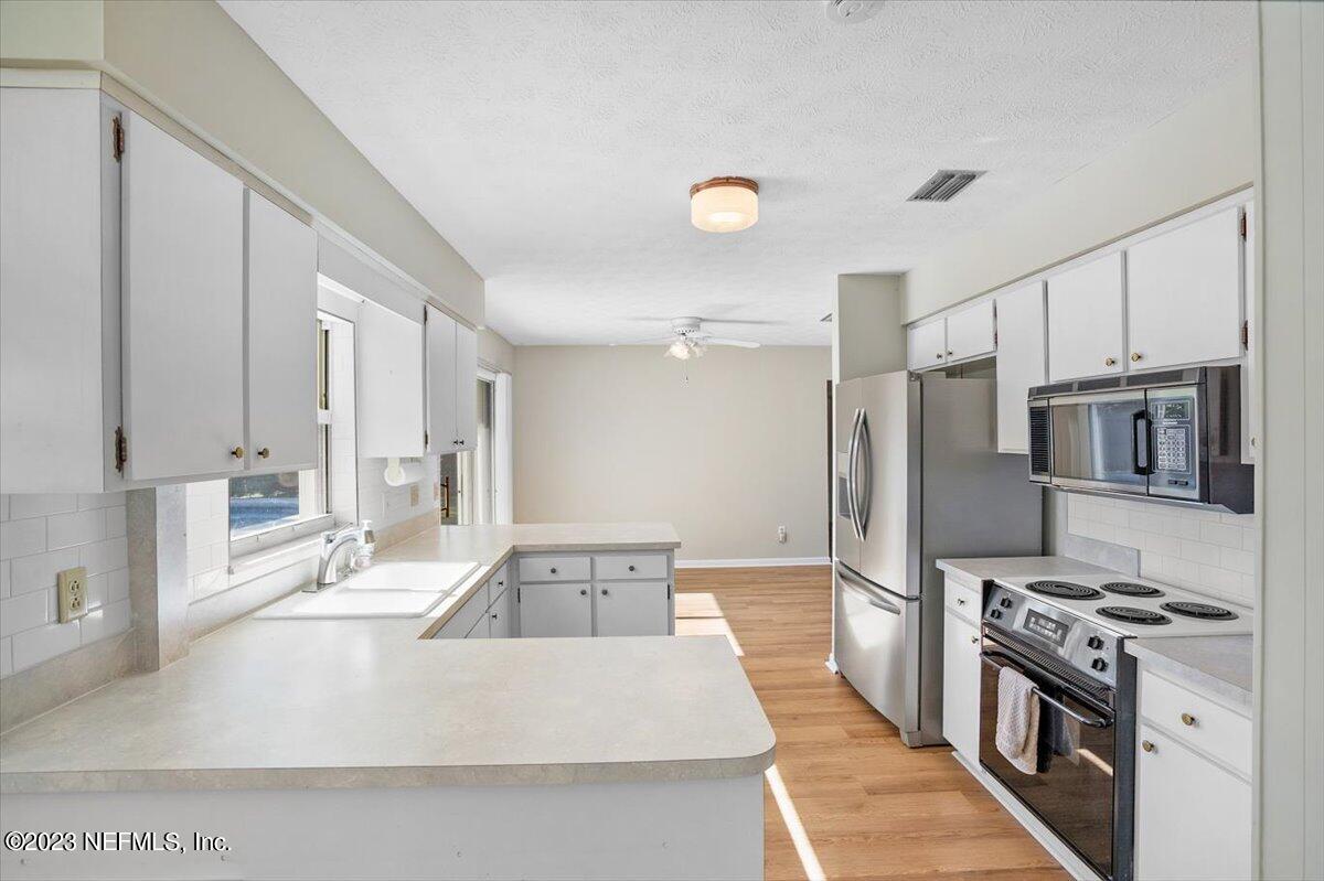 218 Neptune Road Orange Park, FL 32073 - Photo 11 of 31 Plenty of Kitchen Cabinet Space