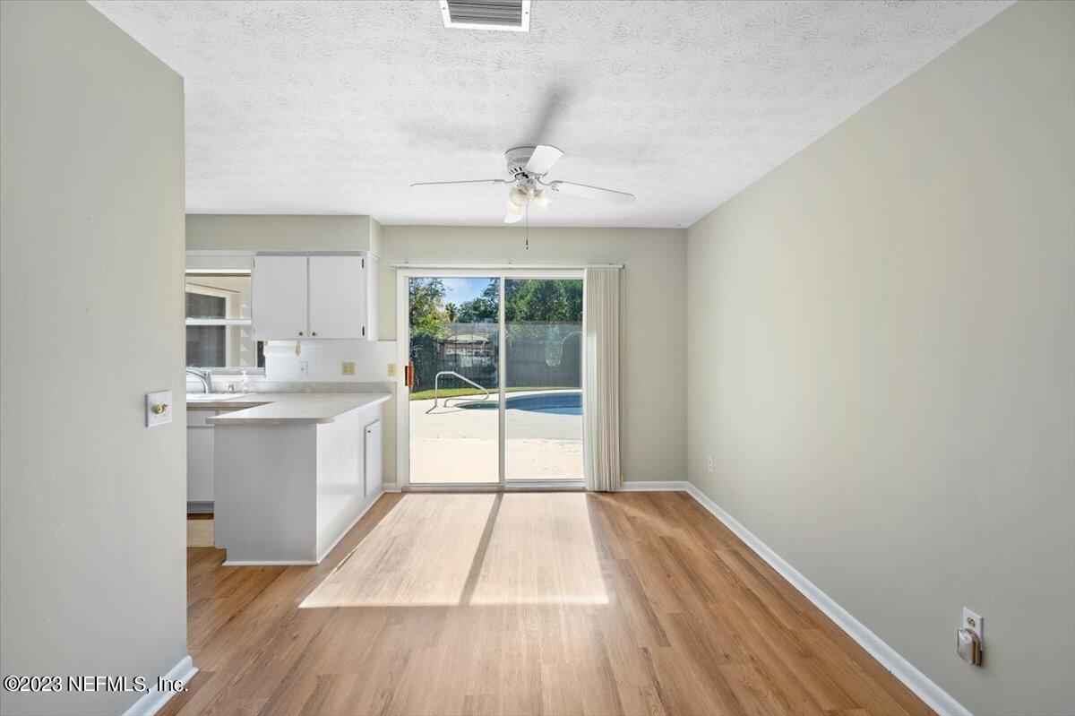 218 Neptune Road Orange Park, FL 32073 - Photo 5 of 31 Dining Area Overlooking the Pool