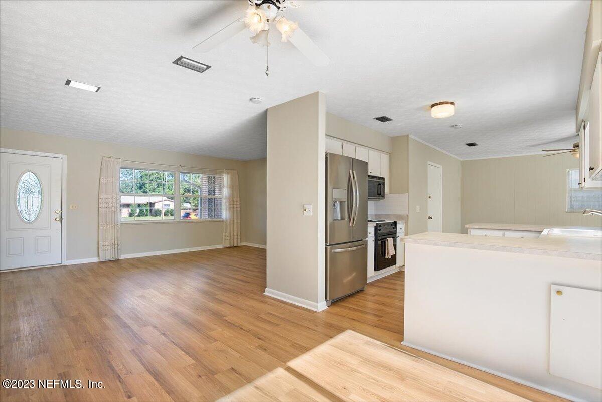 218 Neptune Road Orange Park, FL 32073 - Photo 6 of 31 View Toward the Kitchen and Living Room