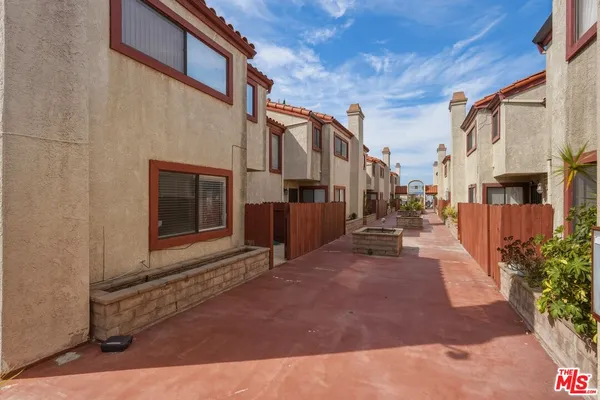 a view of a street with buildings in the background