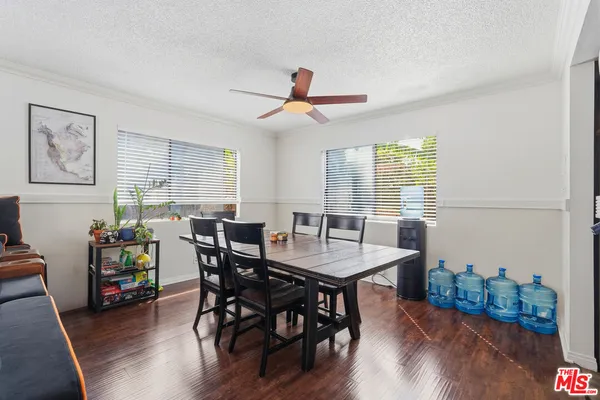 a kitchen with stainless steel appliances granite countertop a refrigerator stove and a sink