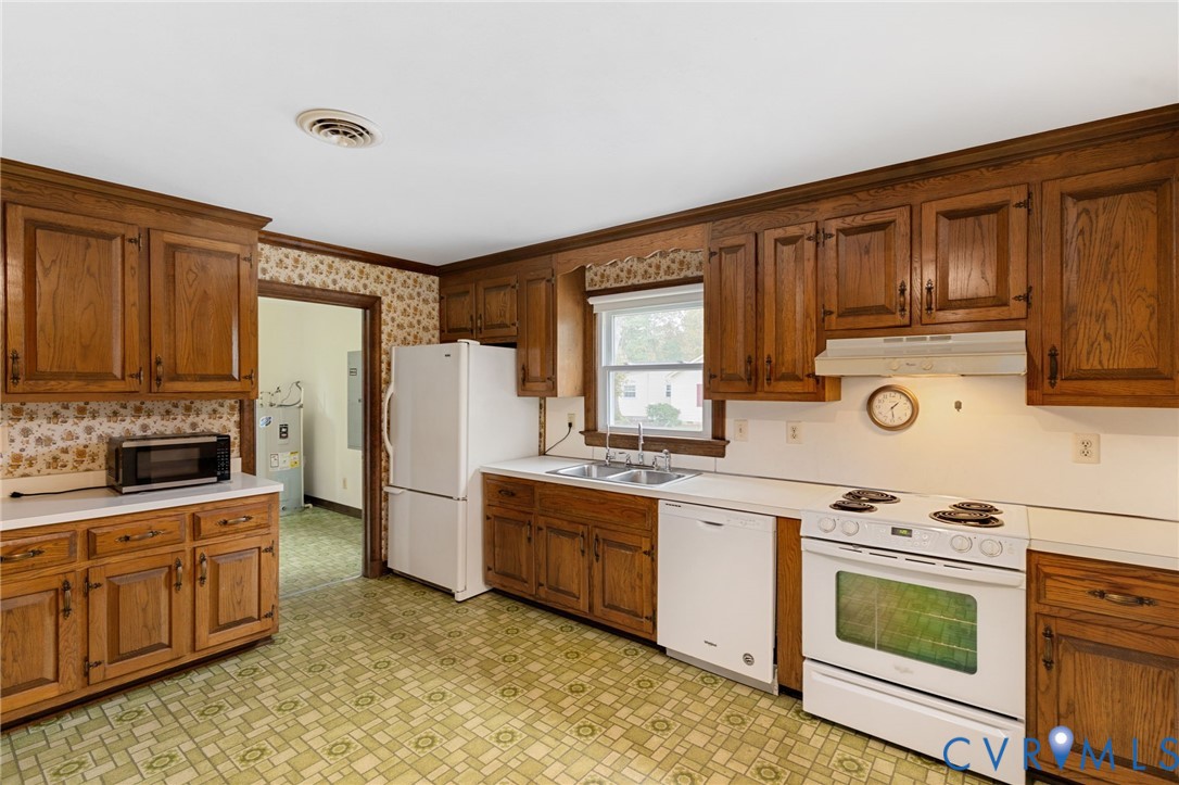 6163 White Oak Road Sandston, VA 23150 - Photo 11 of 39 a kitchen with stainless steel appliances granite countertop a stove a sink dishwasher a refrigerator and cabinets with wooden floor