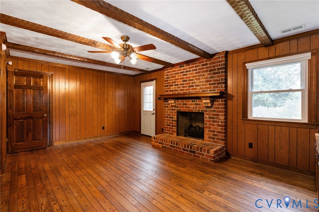 6163 White Oak Road Sandston, VA 23150 - Photo 16 of 39 a view of an empty room with wooden floor fireplace and a window