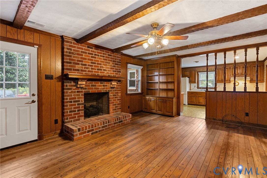 6163 White Oak Road Sandston, VA 23150 - Photo 17 of 39 a view of a livingroom with a fireplace wooden floor and windows