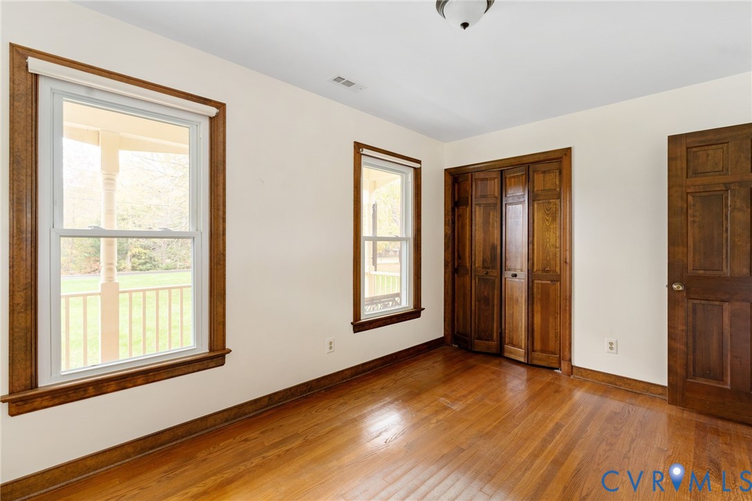6163 White Oak Road Sandston, VA 23150 - Photo 19 of 39 a view of an empty room with wooden floor and a window