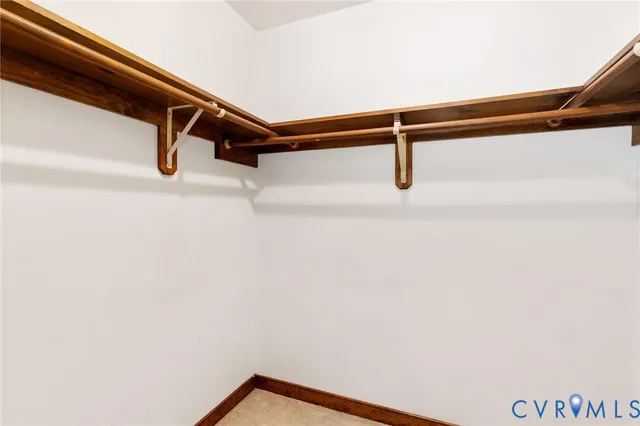 a bathroom with a granite countertop sink toilet and mirror