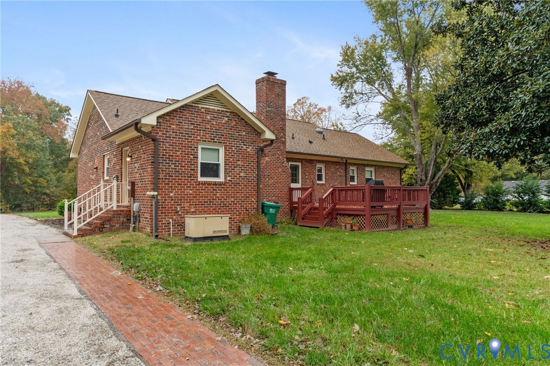 6163 White Oak Road Sandston, VA 23150 - Photo 26 of 39 a front view of a house with garden
