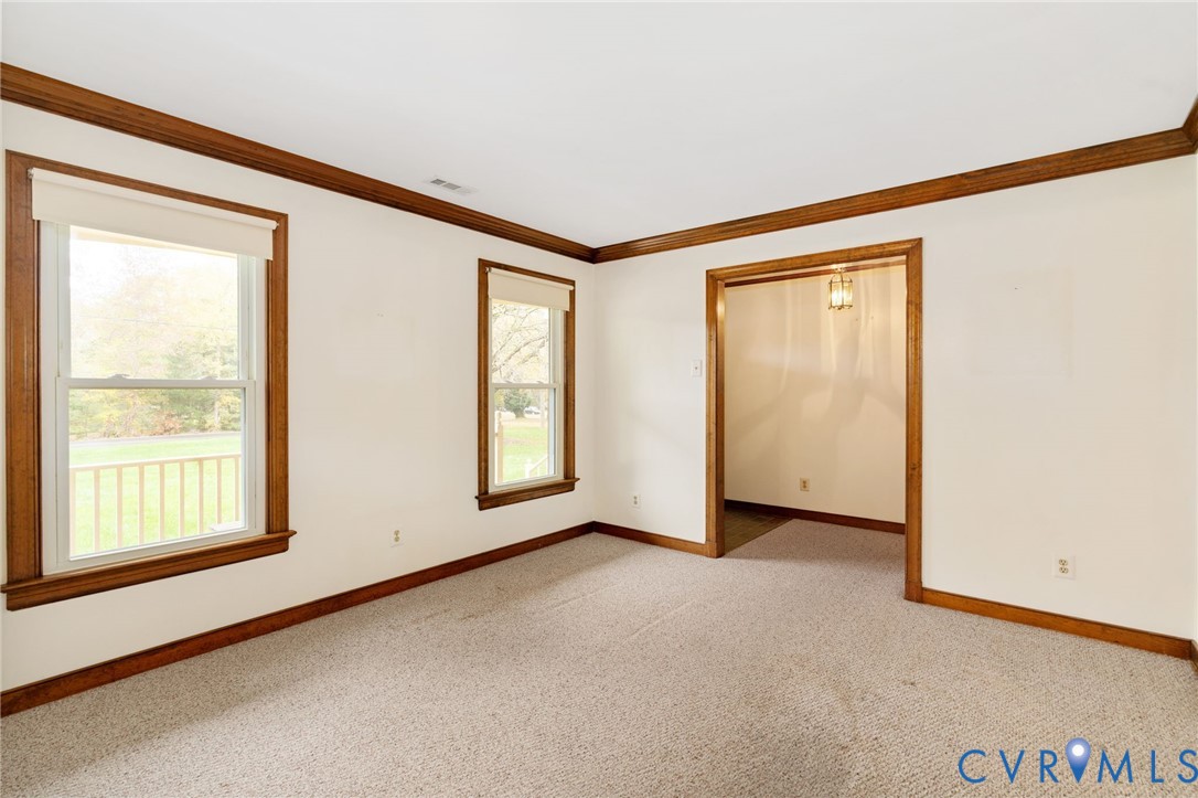 6163 White Oak Road Sandston, VA 23150 - Photo 7 of 39 an empty room with windows and closet