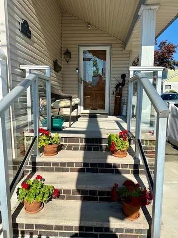 a room with stainless steel appliances kitchen island granite countertop lots of clutter and cars