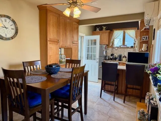 a view of a dining room with furniture window and outside view