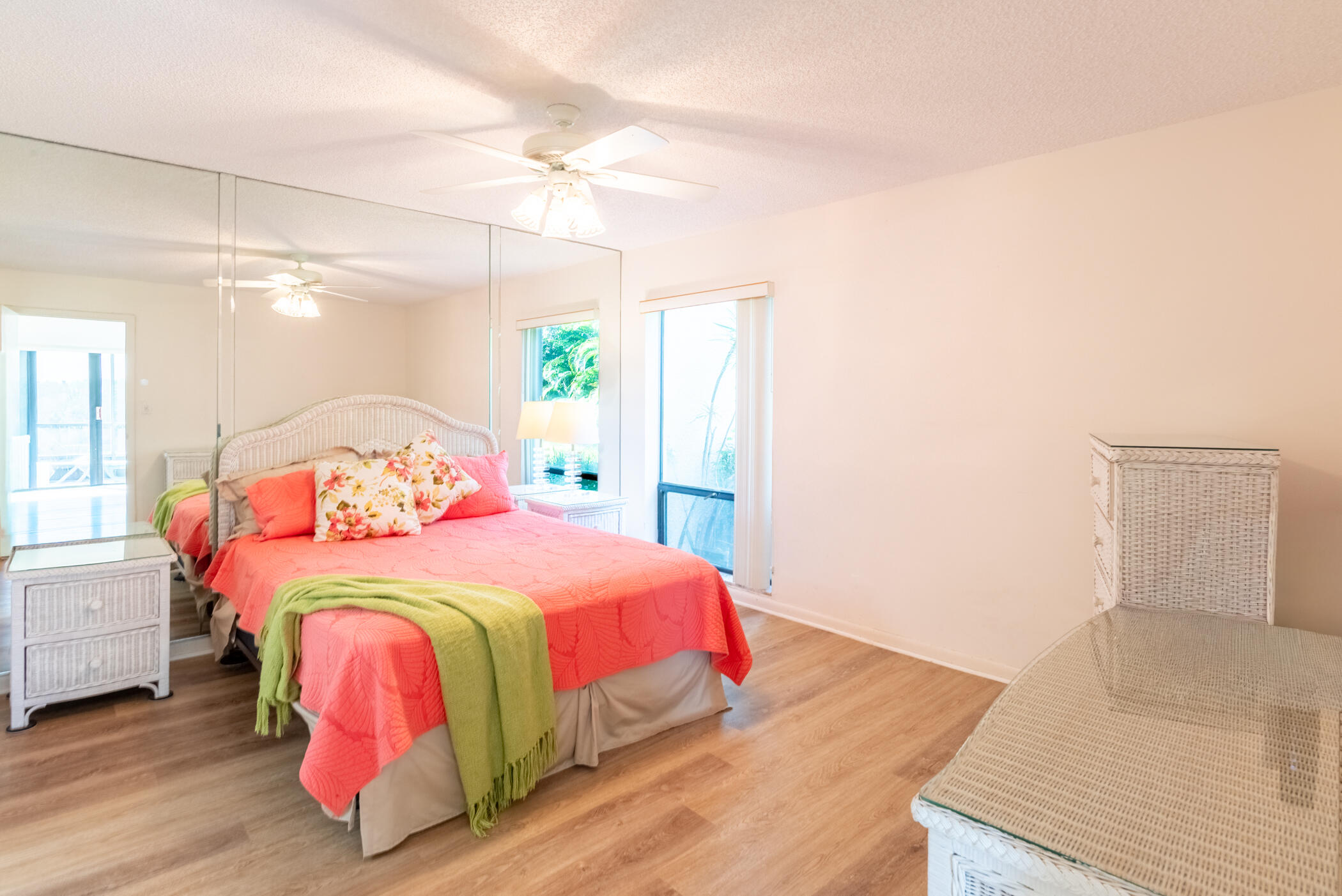 2550 Presidential Way, Unit 107 West Palm Beach, FL 33401 - Photo 15 of 28 a bedroom with a bed and a window