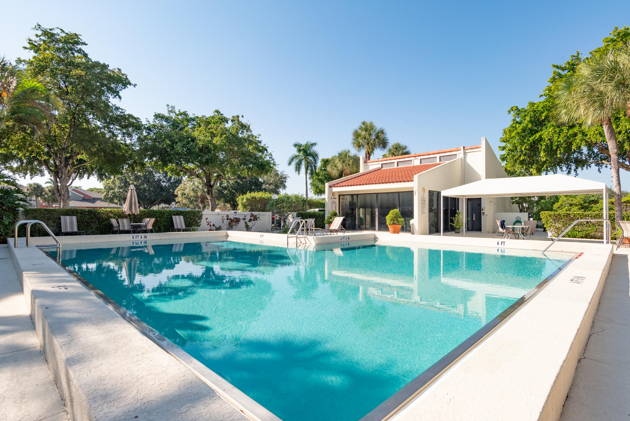 2550 Presidential Way, Unit 107 West Palm Beach, FL 33401 - Photo 23 of 28 swimming pool view with a seating space
