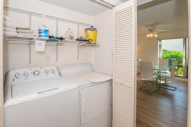 a kitchen with a white stove top oven and refrigerator