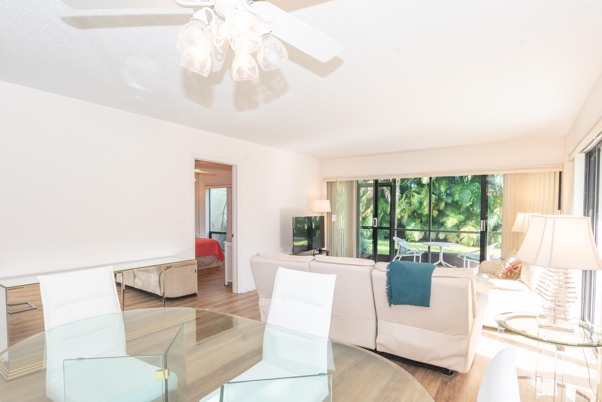2550 Presidential Way, Unit 107 West Palm Beach, FL 33401 - Photo 3 of 28 a living room with furniture and a large window
