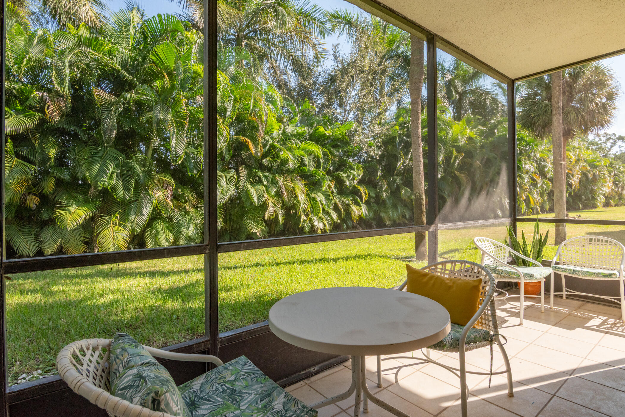 2550 Presidential Way, Unit 107 West Palm Beach, FL 33401 - Photo 9 of 28 a view of a swimming pool with a lounge chair