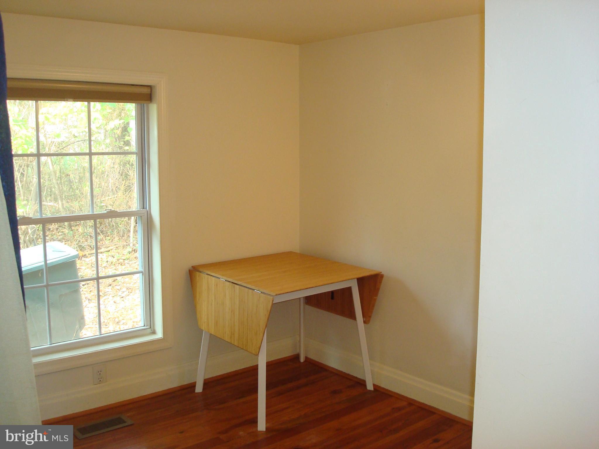 605 Norway Road Kennett Square, PA 19348 - Photo 12 of 33 a view of an empty room with wooden floor and a window