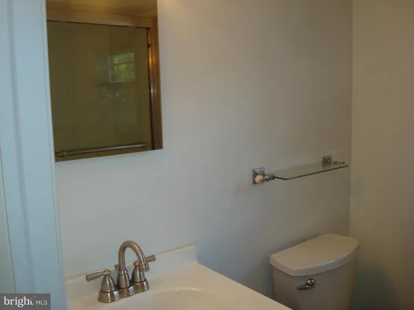 a bathroom with a toilet and a sink