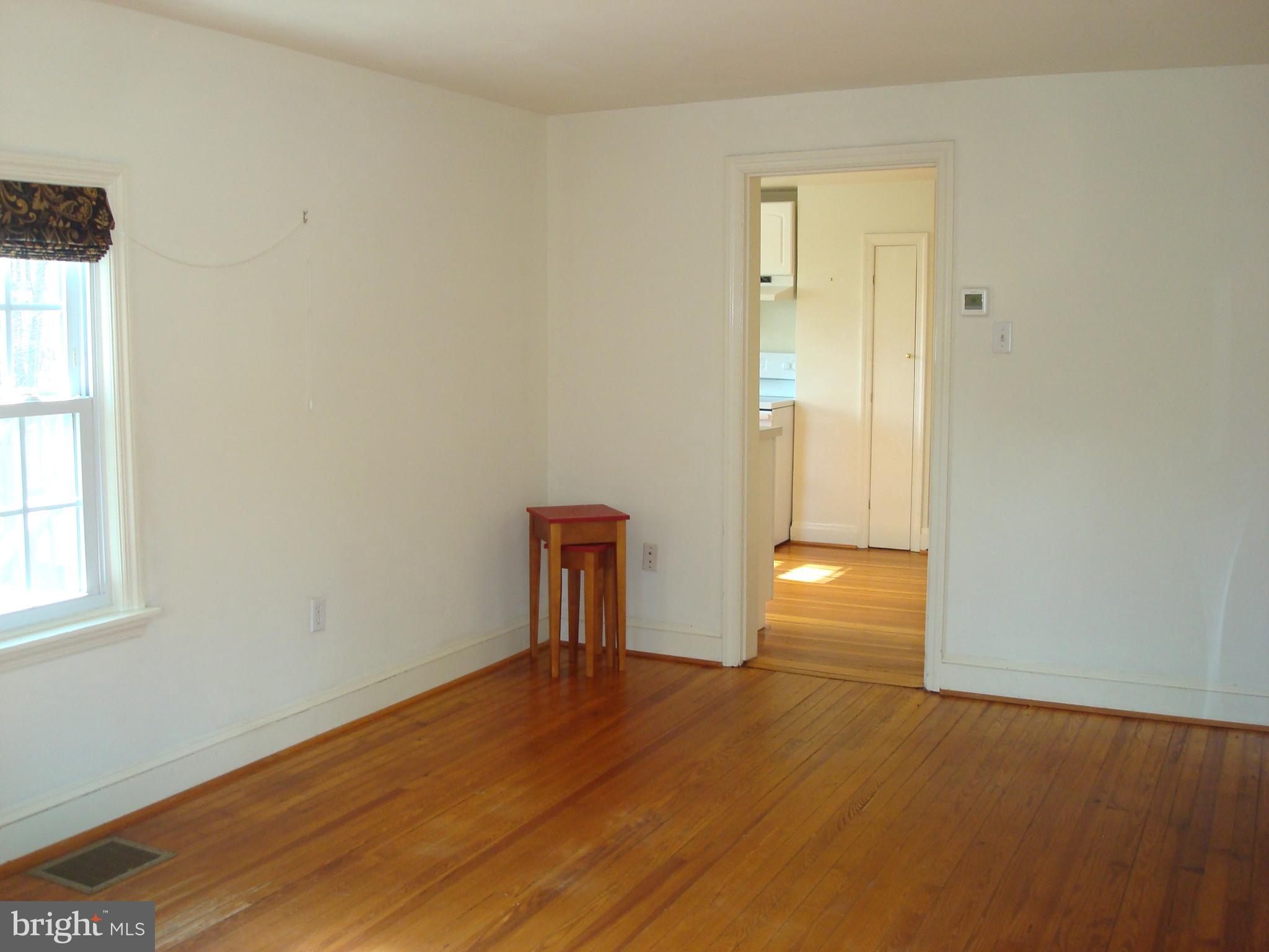 605 Norway Road Kennett Square, PA 19348 - Photo 4 of 33 a view of empty room with wooden floor and fan