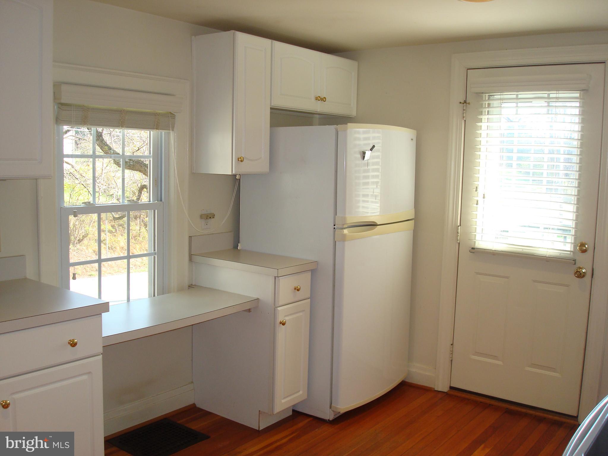 605 Norway Road Kennett Square, PA 19348 - Photo 8 of 33 a white refrigerator freezer sitting inside of a kitchen