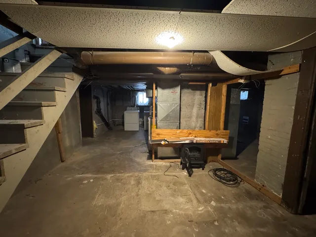 a living room with a furniture and a fireplace