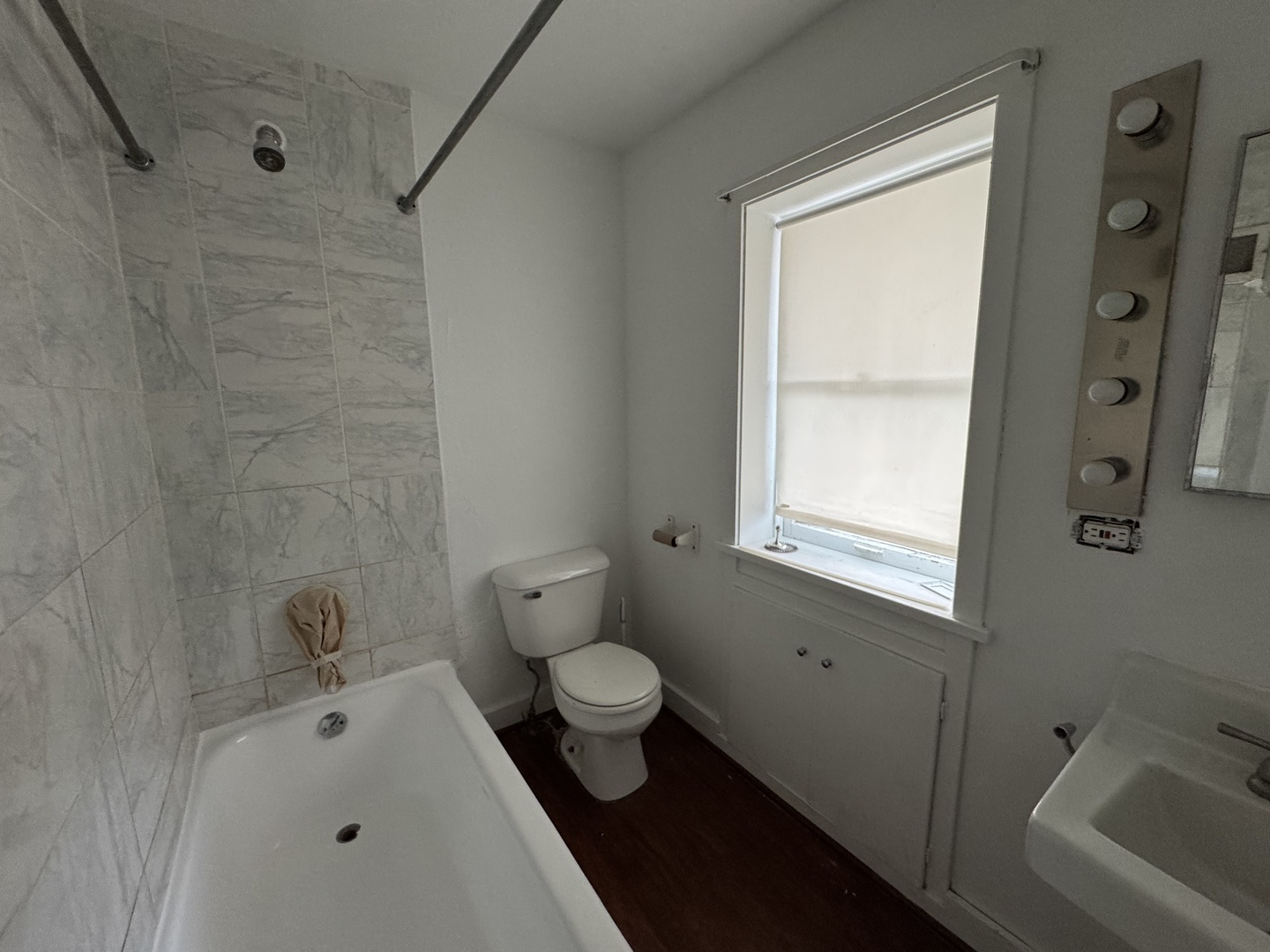 402 Joliet Street, Unit 1 West Chicago, IL 60185 - Photo 6 of 12 a bathroom with a bathtub sink and toilet