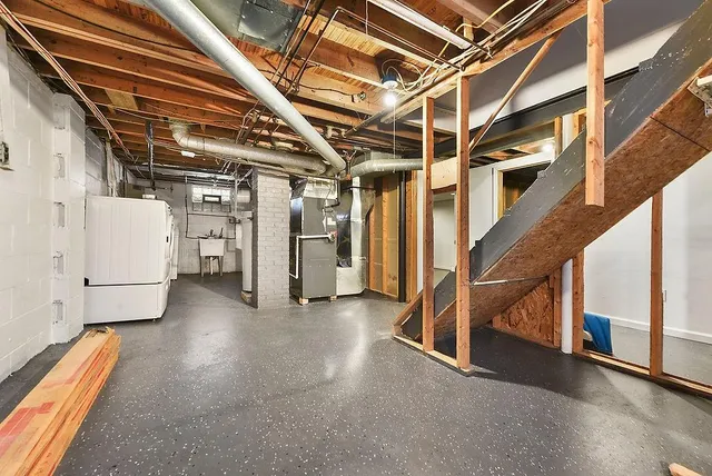 a view of storage and utility room with stairs
