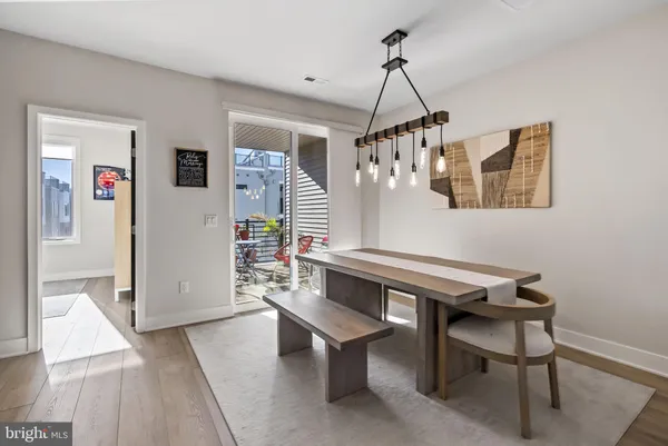 a kitchen with stainless steel appliances kitchen island granite countertop a stove a sink and a refrigerator