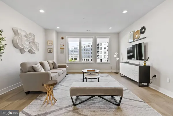 a living room with furniture and a piano