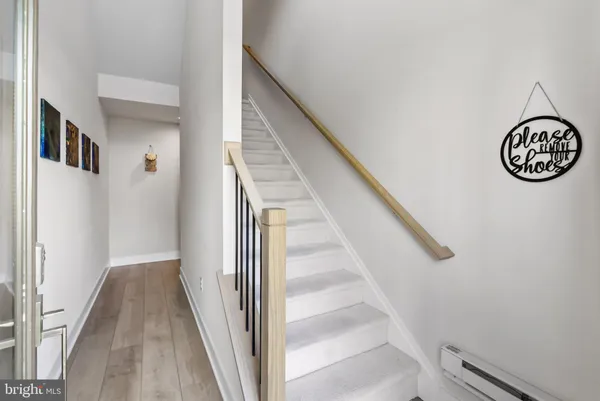 a view of entryway with wooden floor