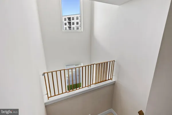 a view of staircase with white walls