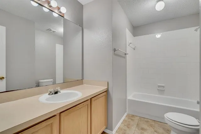 a bathroom with a sink a toilet and a bathtub