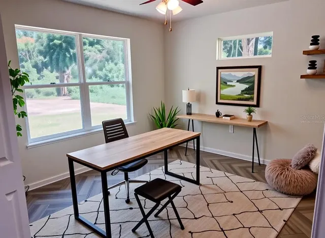a view of a livingroom with furniture and window