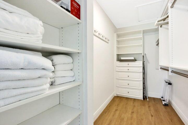 717 Highway 1, Unit 510 Jupiter, FL 33477 - Photo 18 of 26 a view of walk in closet with clothes and shoes