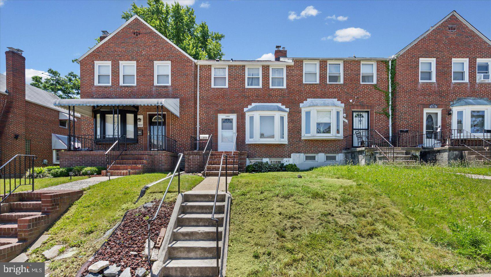 1805 Crestview Road Baltimore, MD 21239 - Photo 1 of 39 a front view of a house with a yard