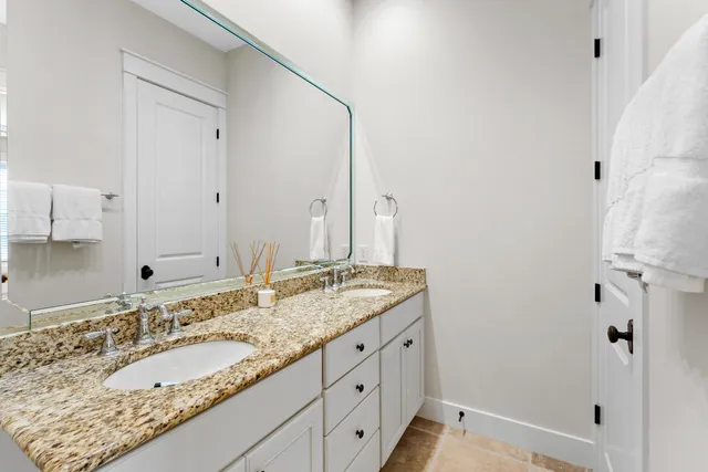 a bedroom with a bed and a dresser in it