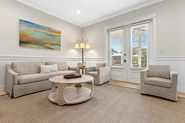 a kitchen with stainless steel appliances a stove a chimney a refrigerator and a counter space