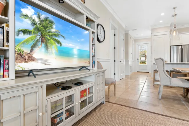 a large kitchen with granite countertop a stove a sink a dining table and chairs