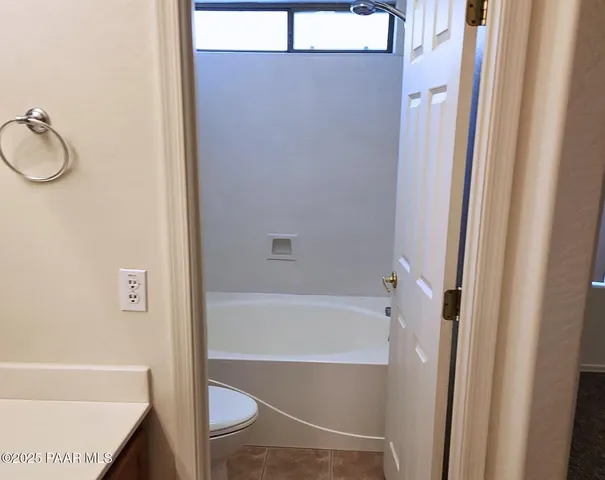 a bathroom with a tub and a shower