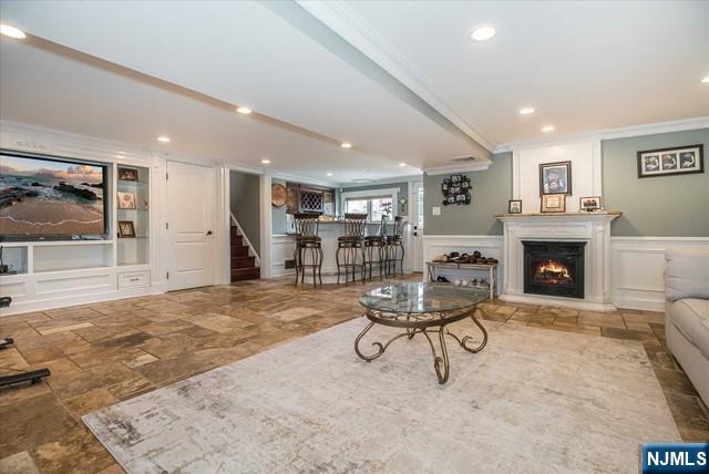 16 Lawrence Road Wayne, NJ 07470 - Photo 11 of 28 a view of a livingroom with furniture and a fireplace