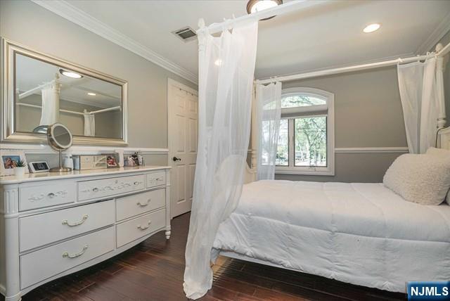 16 Lawrence Road Wayne, NJ 07470 - Photo 18 of 28 a bedroom with a bed and a mirror on dresser