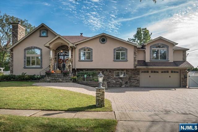 16 Lawrence Road Wayne, NJ 07470 - Photo 2 of 28 a front view of a house with garden
