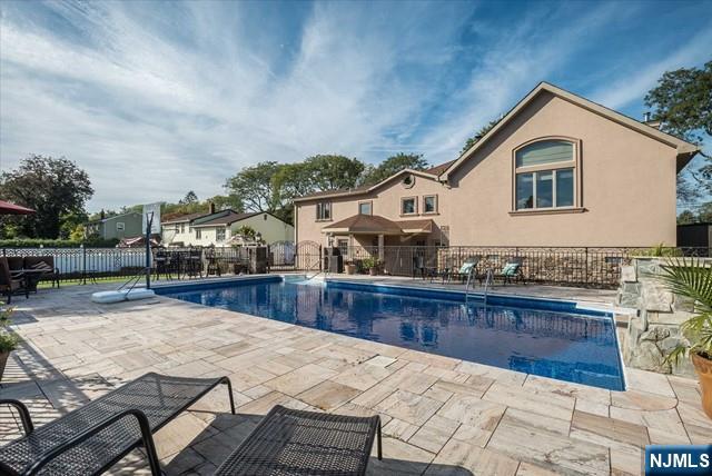 16 Lawrence Road Wayne, NJ 07470 - Photo 27 of 28 a view of house with backyard and sitting area