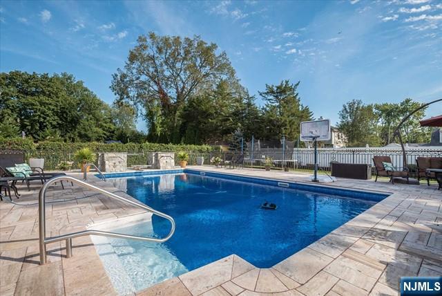 16 Lawrence Road Wayne, NJ 07470 - Photo 28 of 28 a view of a swimming pool with a lounge chair