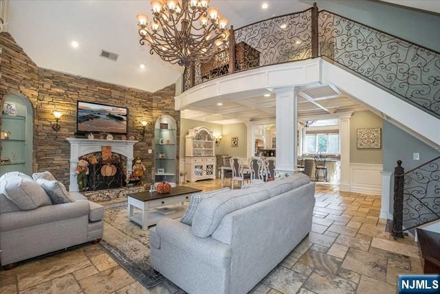 16 Lawrence Road Wayne, NJ 07470 - Photo 3 of 28 a living room with furniture and a fireplace