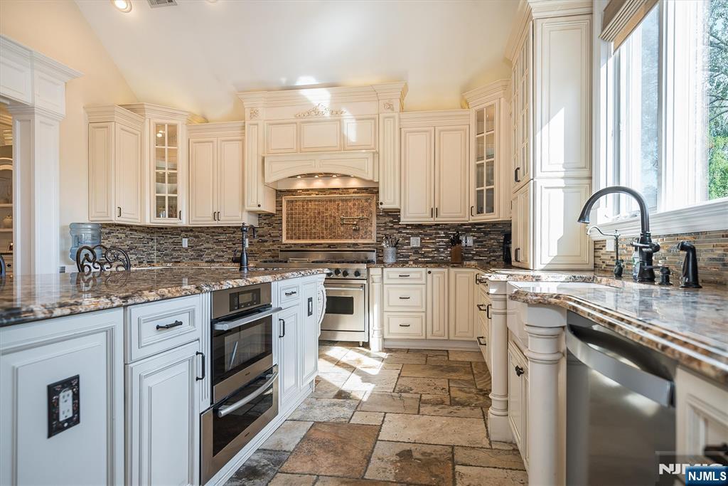16 Lawrence Road Wayne, NJ 07470 - Photo 6 of 28 a kitchen with appliances cabinets and a sink