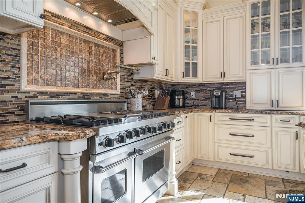 16 Lawrence Road Wayne, NJ 07470 - Photo 7 of 28 a kitchen with stainless steel appliances granite countertop a stove and a sink