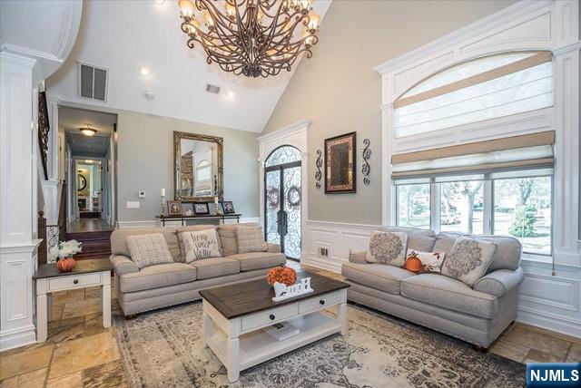 16 Lawrence Road Wayne, NJ 07470 - Photo 8 of 28 a living room with furniture and a large window
