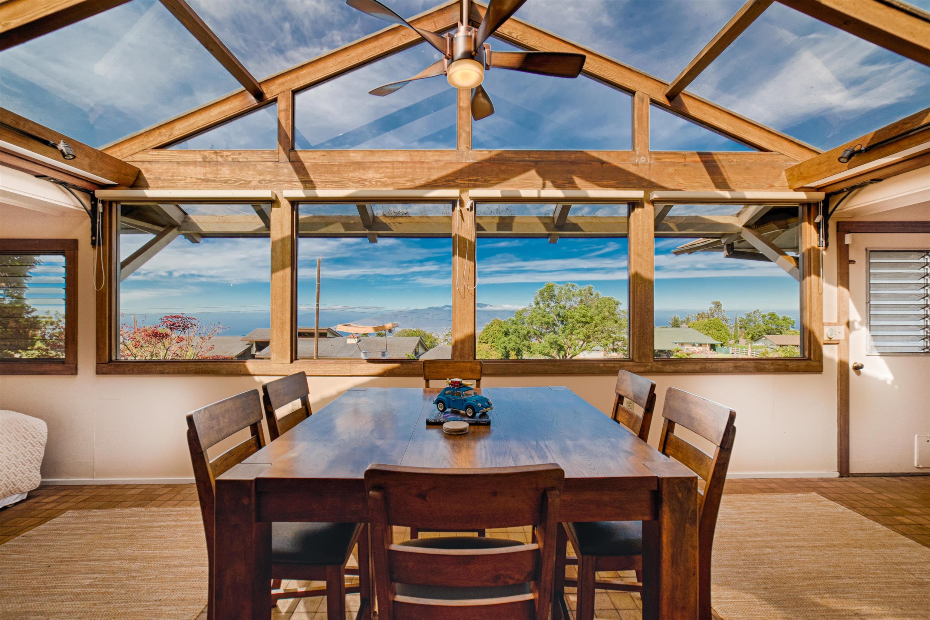 a view of a dining room with furniture and window
