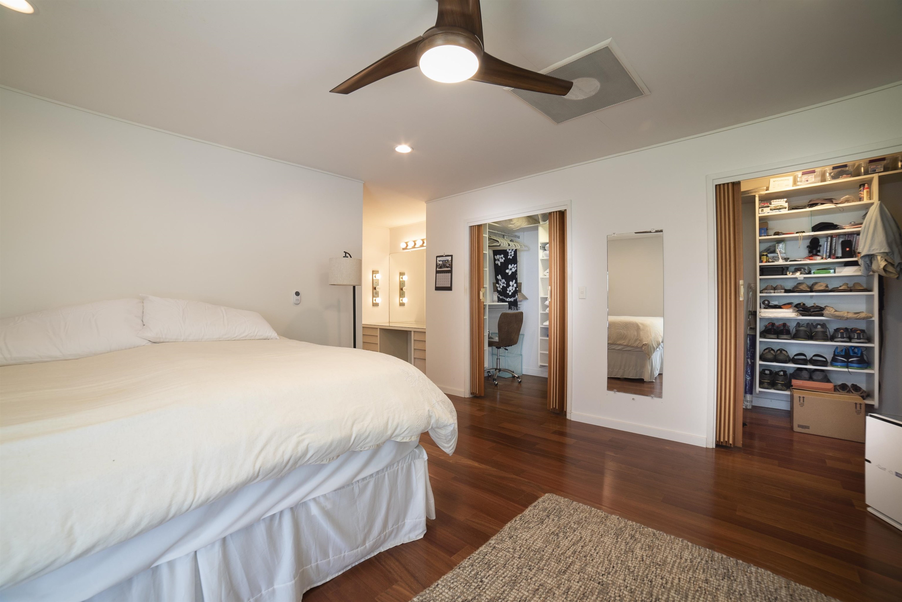 100 A Ihe Place Kula, HI 96790 - Photo 14 of 21 a spacious bedroom with a bed and a walk in closet